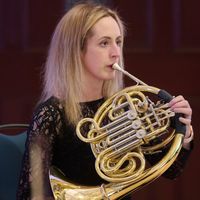 Christine McGinley playing french horn